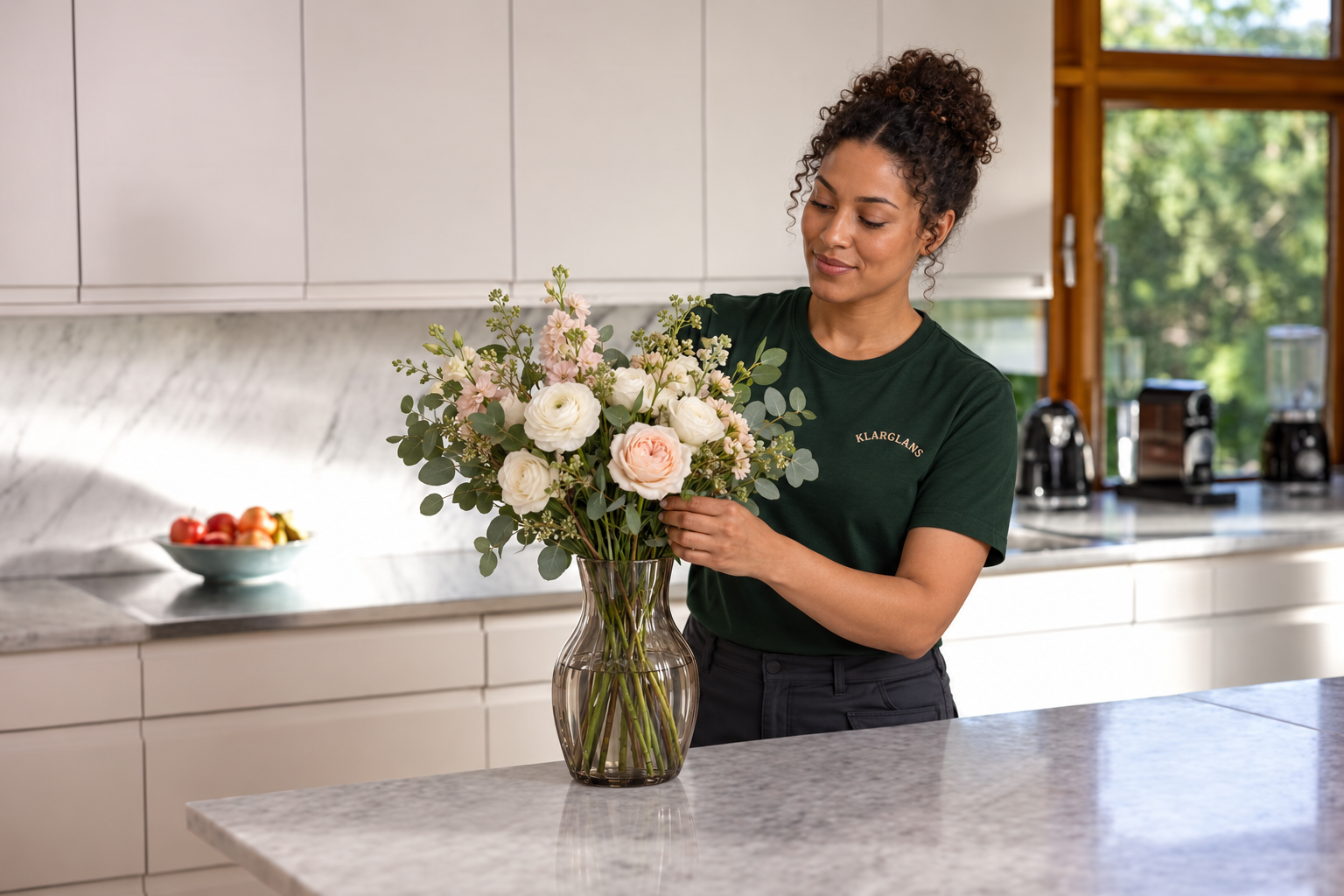 Klarglans team member in a bright, modern kitchen
